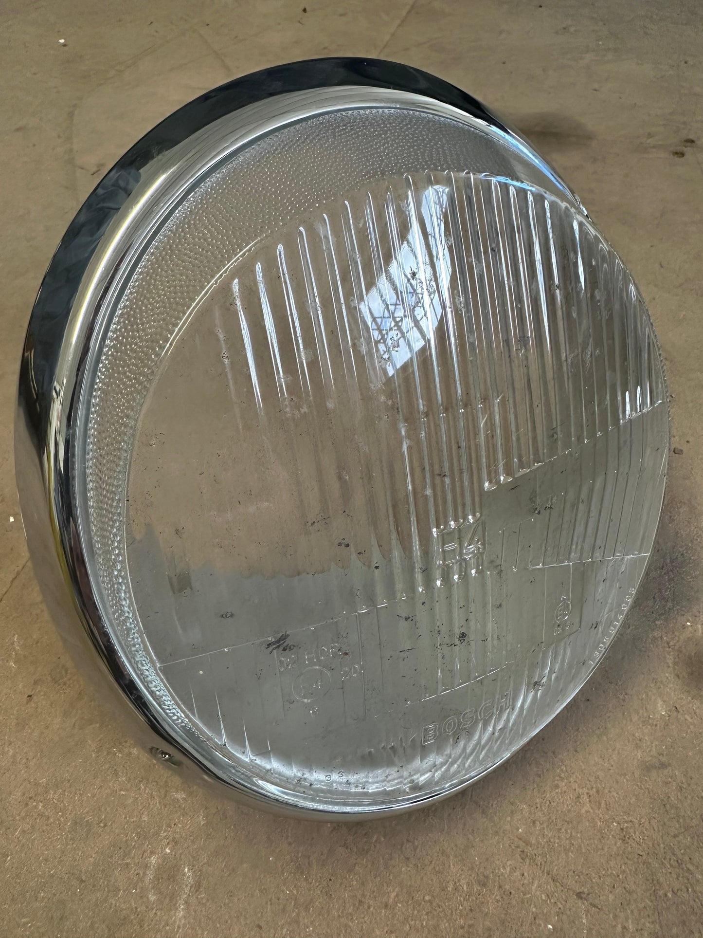 Bosch H4 lens (RHD) headlamp bucket and chrome trim ring p/n 911.631.112.00