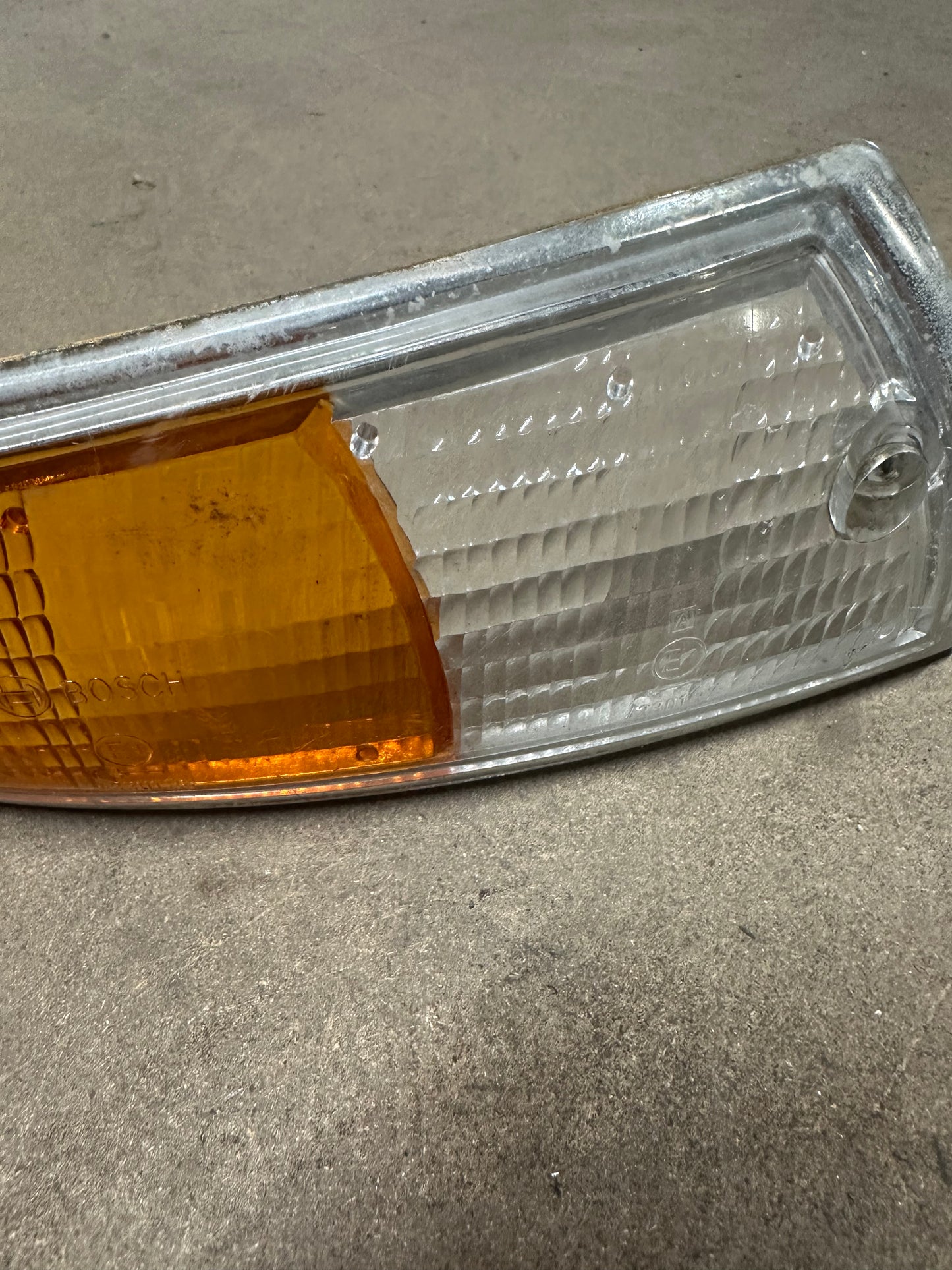 Genuine Porsche front direction lens ‘69-‘72 (chrome trim), p/n 911.631.924.03