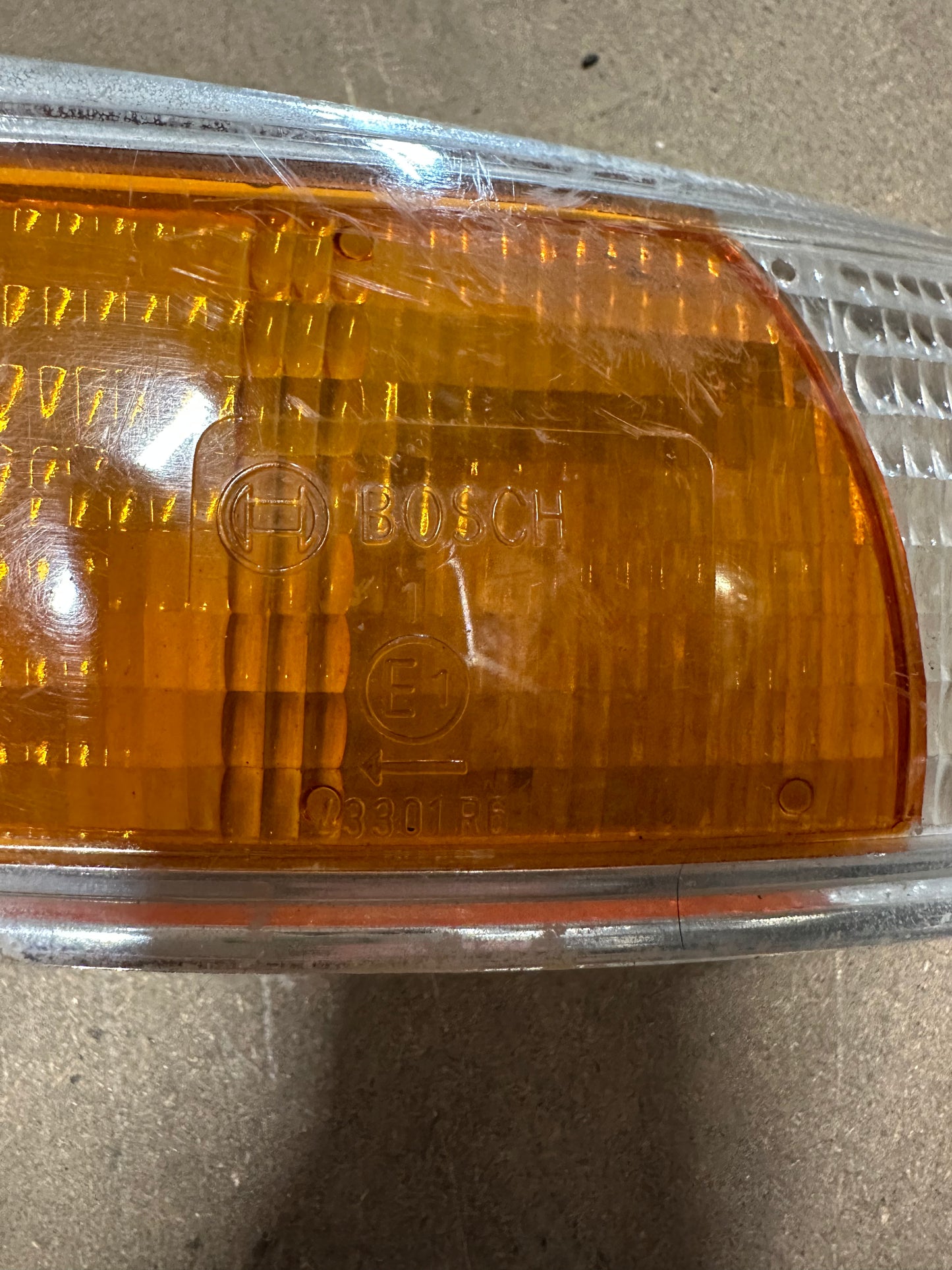 Genuine Porsche front direction lens ‘69-‘72 (chrome trim), p/n 911.631.924.03