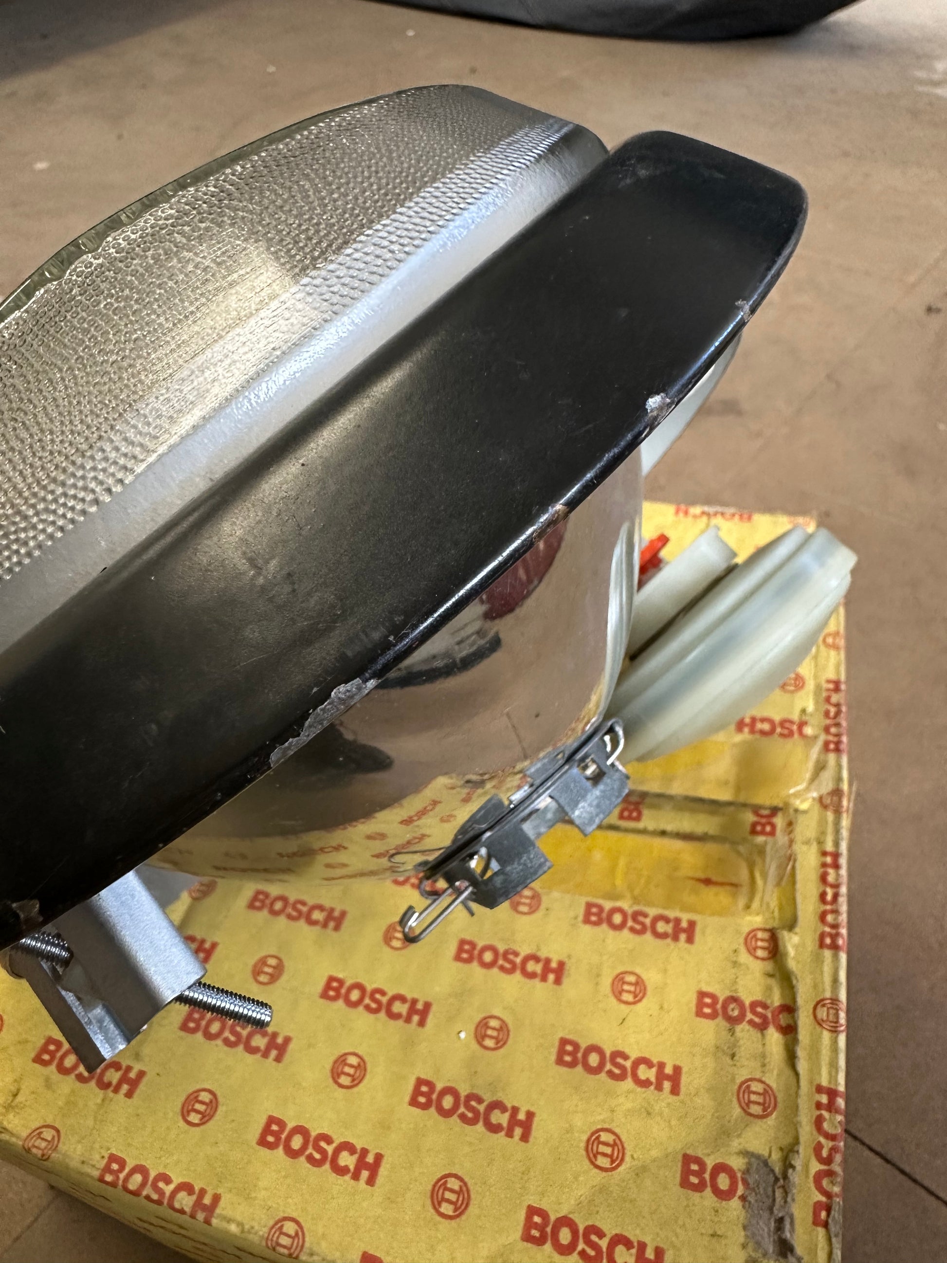 Pair of genuine Porsche / Bosch H4 headlamps for 911 G-model ‘87-‘89 (LHD) with RHD lenses, p/n 911.631.924.03