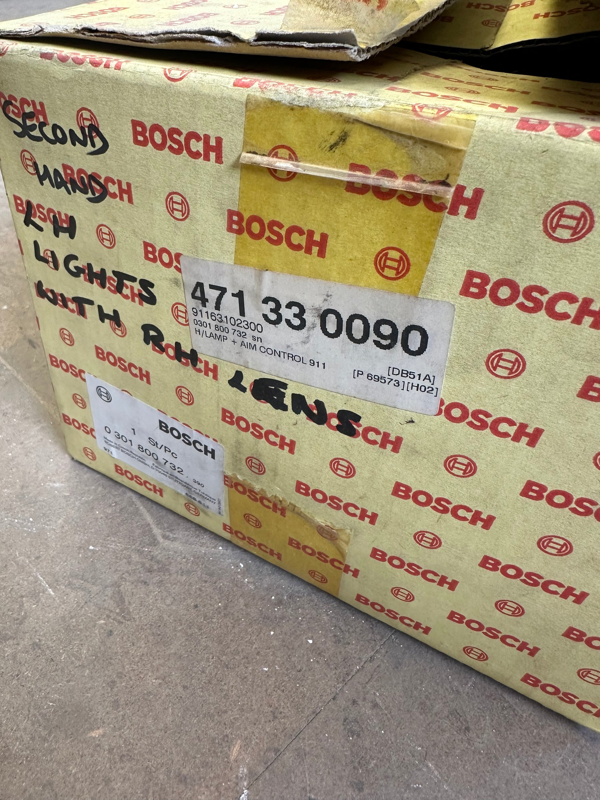 Pair of genuine Porsche / Bosch H4 headlamps for 911 G-model ‘87-‘89 (LHD) with RHD lenses, p/n 911.631.924.03